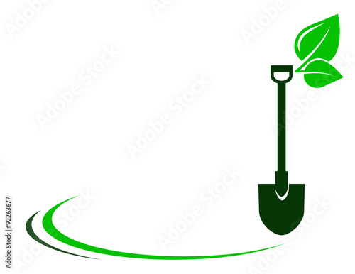 garden background with shovel and green leaf
