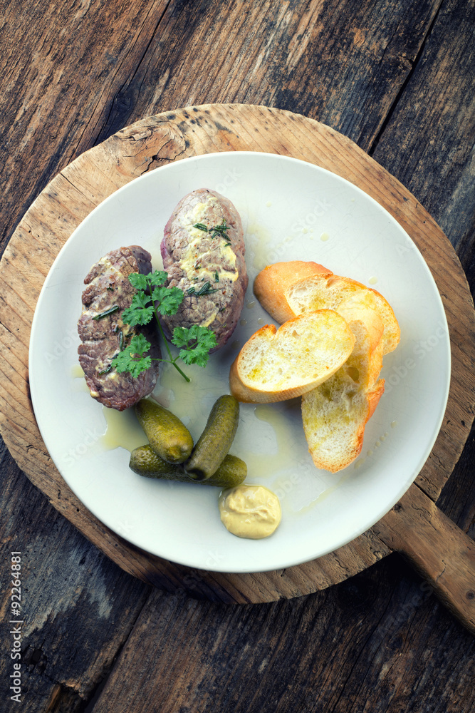 Beef steak with rosemary and baguette Beef steak with rosemary and baguette