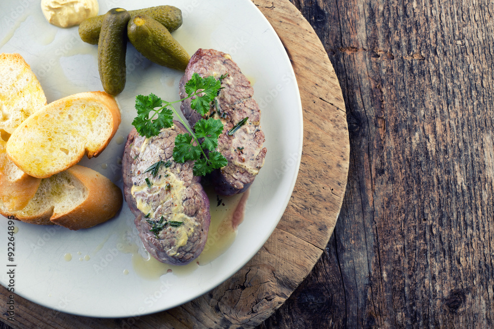 Beef steak with rosemary and baguette