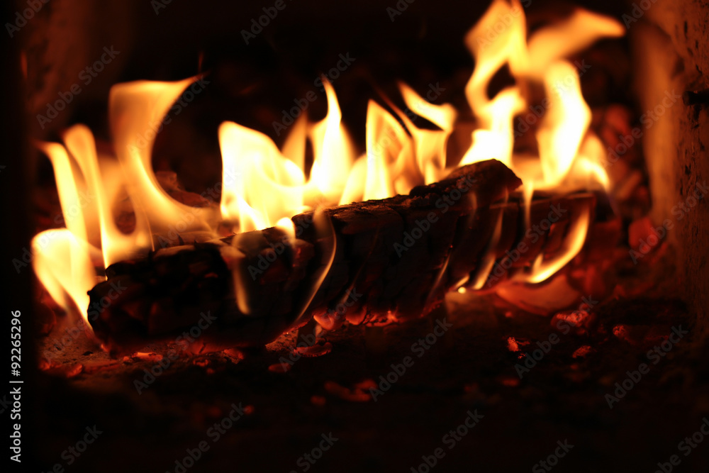 firewood burning in the furnace coals firewood burning in the furnace coals