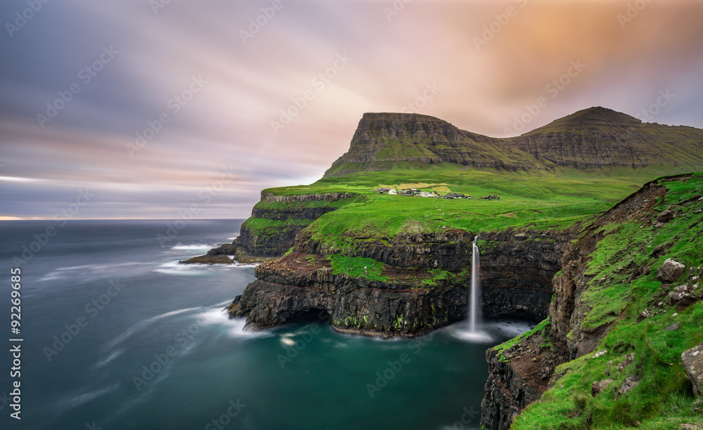 Fototapeta premium Gasadalur village and its waterfall, Faroe Islands, Denmark