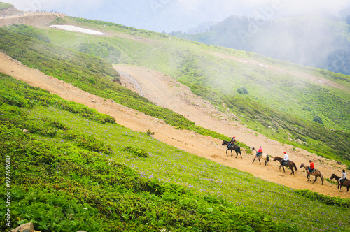 Mountain landscape, the riders on horses