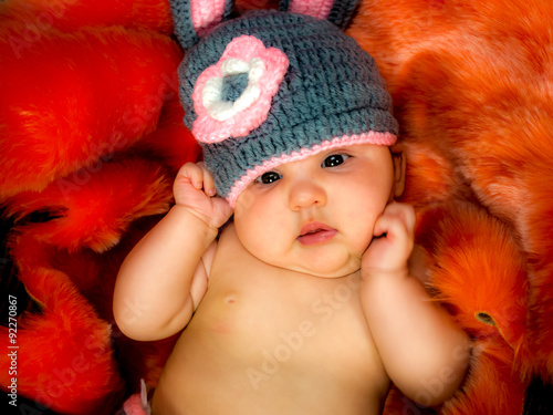 cute baby girl in the basket photo