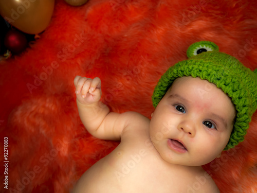 cute baby girl in the basket photo