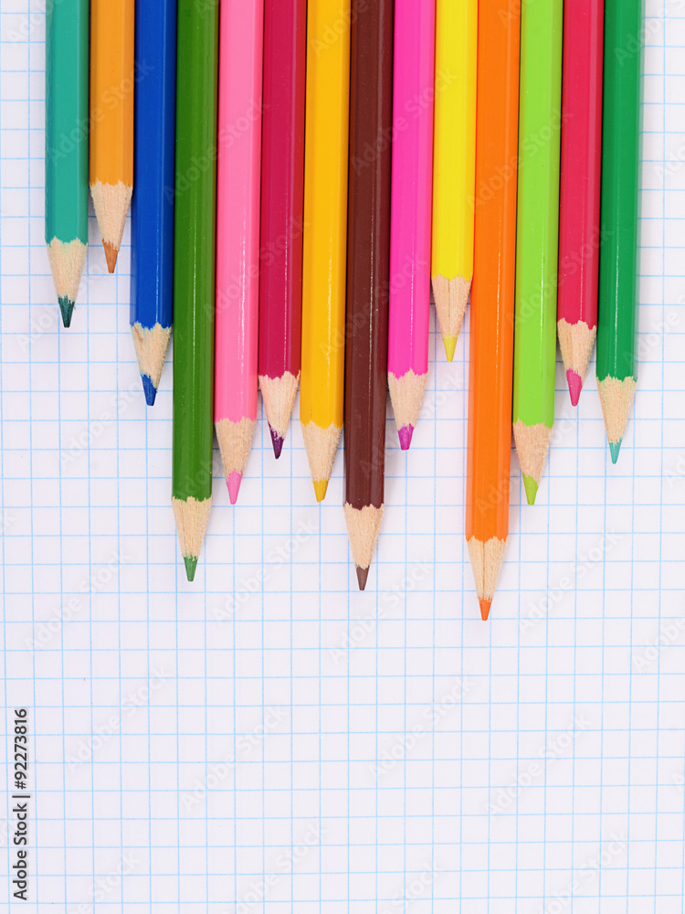 Obraz premium color pencils against a sheet in cage