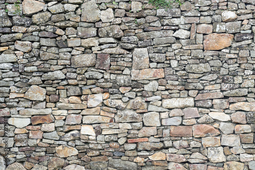 Texture of old weathered medieval stone wall