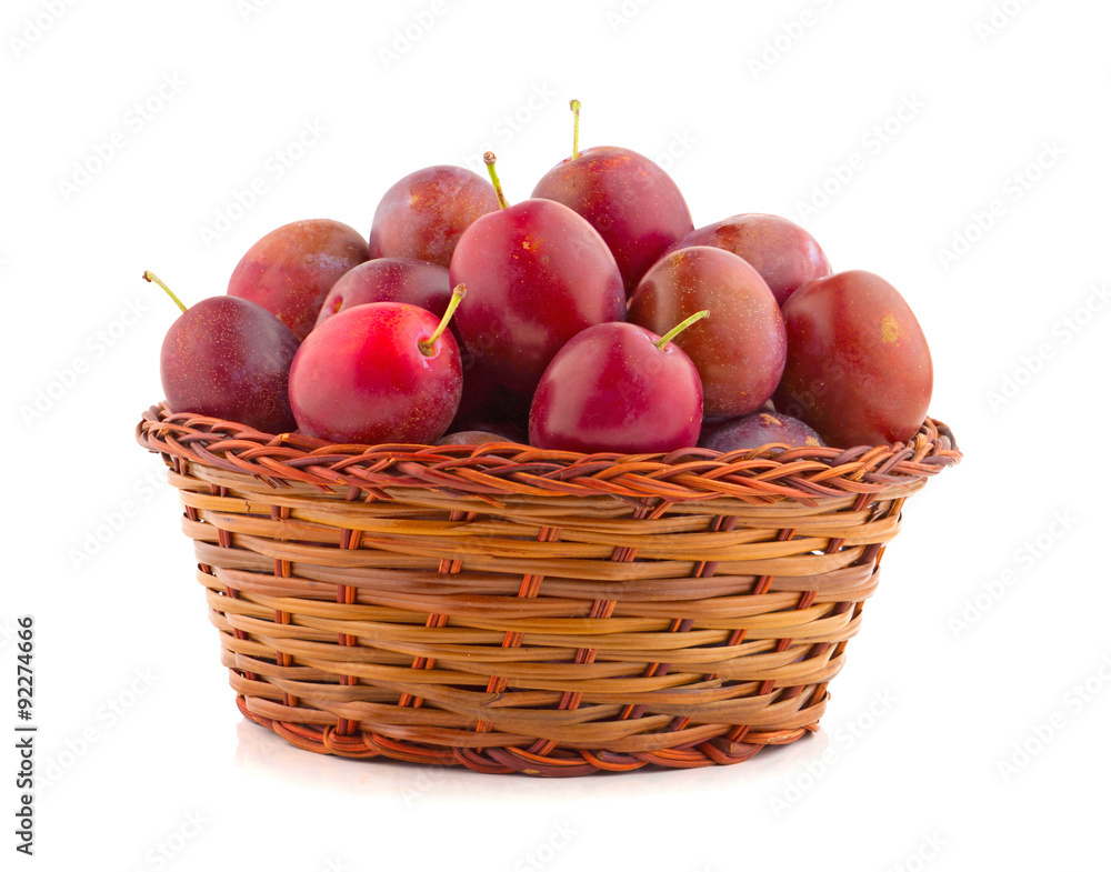 basket full of fresh plums basket full of fresh plums
