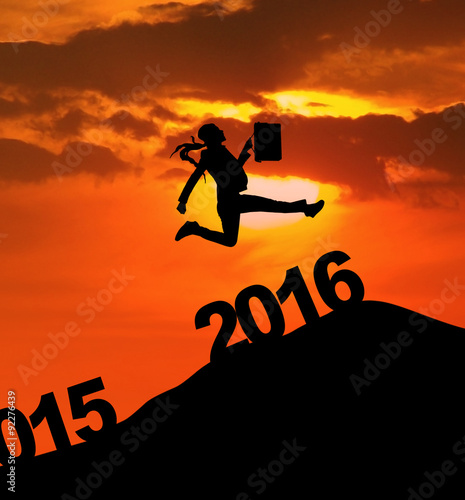 Businesswoman jumping over 2016 numbers © Creativa Images