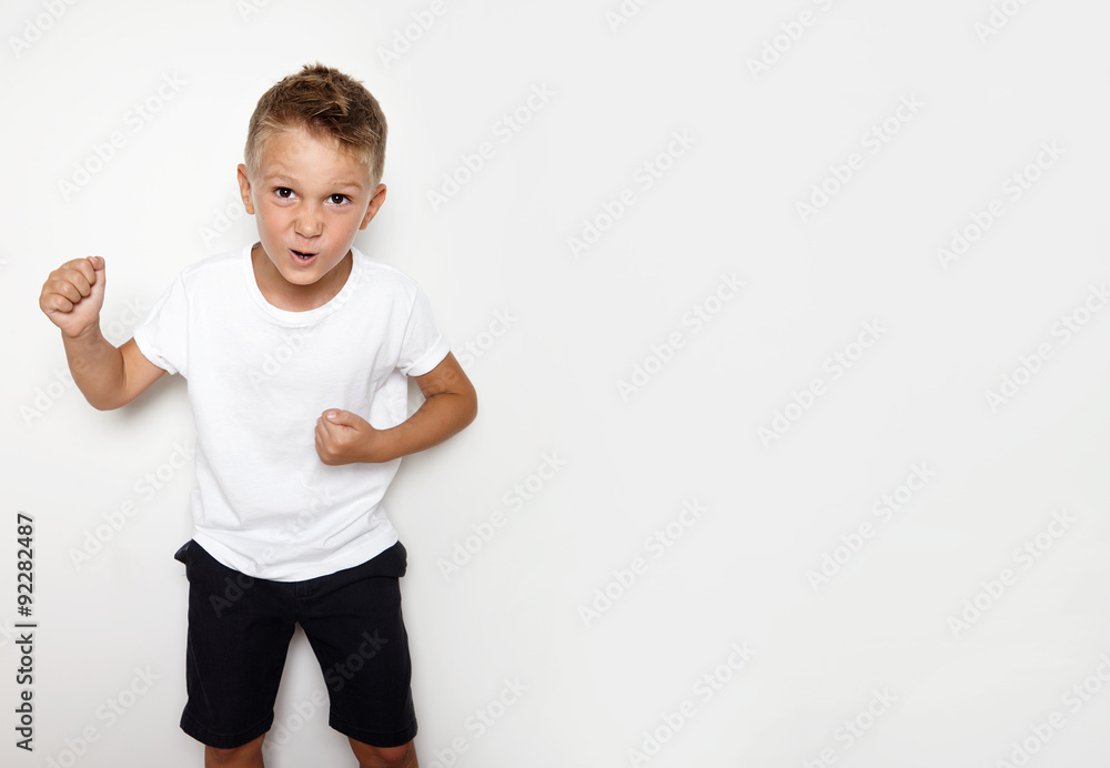 Mock up of funny young hooligan showing some angry emotion Mock up of funny young hooligan showing some angry emotion