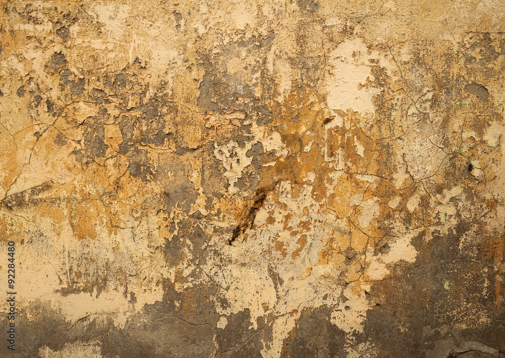 Texture of old wall covered with yellow stucco