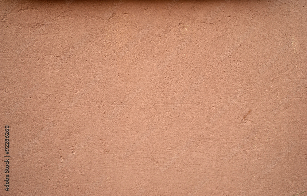 Fototapeta premium Texture of old wall covered with pink stucco
