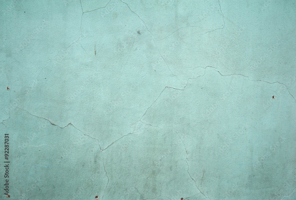 Naklejka premium Texture of old wall covered with green stucco