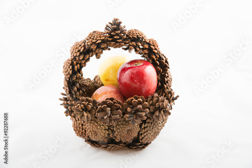 Fir cone basket with apples