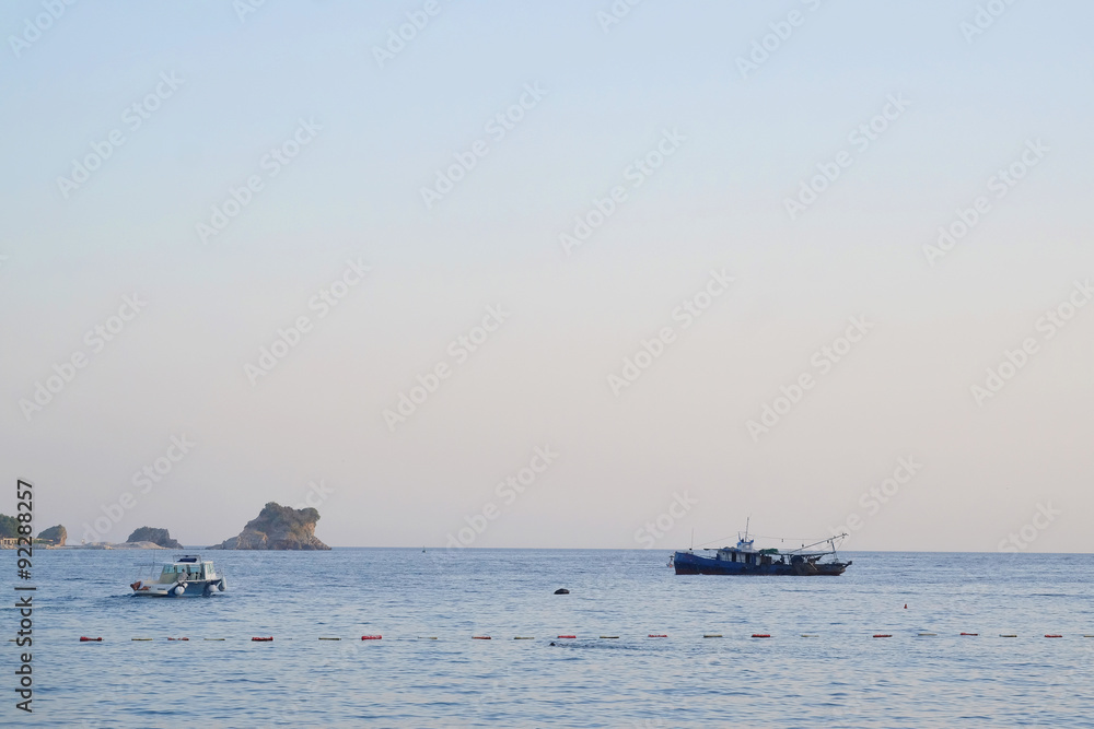 Boat in the Adriatic sea in Budva , Montenegro Boat in the Adriatic sea in Budva , Montenegro