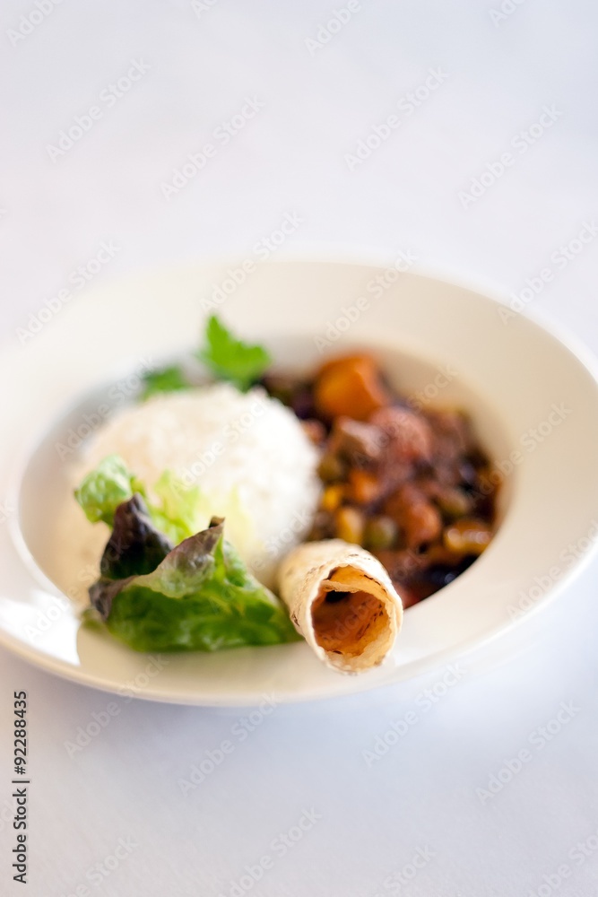 Bowl of Indian vegetable curry with rice and naan Bowl of Indian vegetable curry with rice and naan