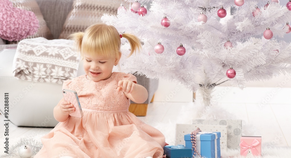 Fototapeta premium Cute little girl at christmas eve