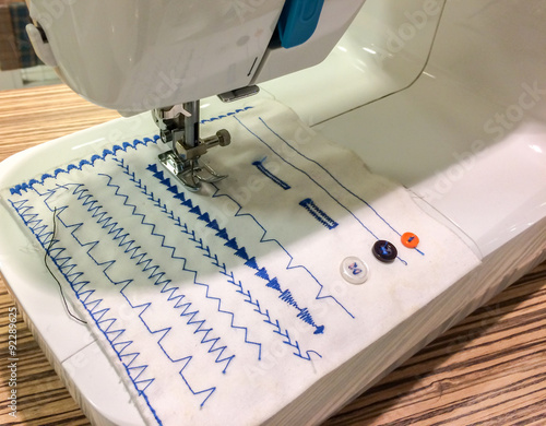 Bild auf Leinwand Sewing Machine making Blue Pattern