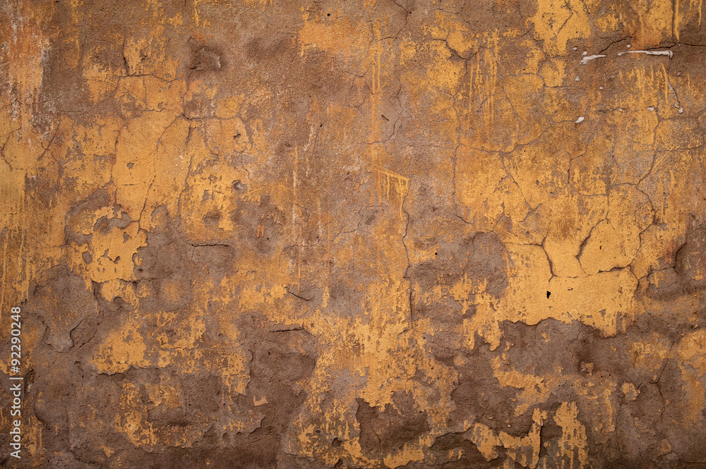 Texture of old wall covered with yellow stucco Texture of old wall covered with yellow stucco