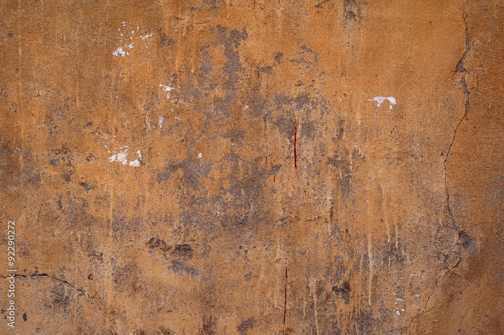Texture of old wall covered with brown stucco Texture of old wall covered with brown stucco