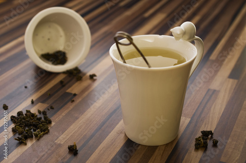 Green tea in decorated tea cup on wood table clean photo