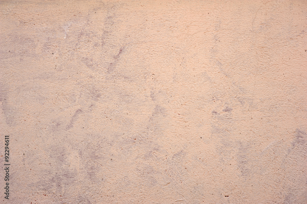 Texture of old wall covered with yellow stucco Texture of old wall covered with yellow stucco