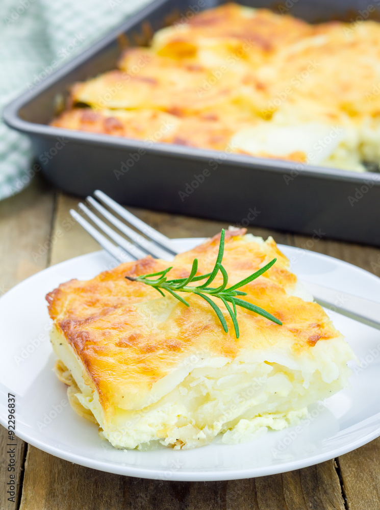 Potato gratin on a white plate Potato gratin on a white plate