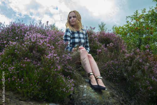 Young woman in the heather.