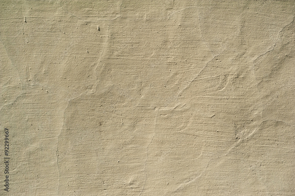 Texture of old wall covered with yellow stucco Texture of old wall covered with yellow stucco