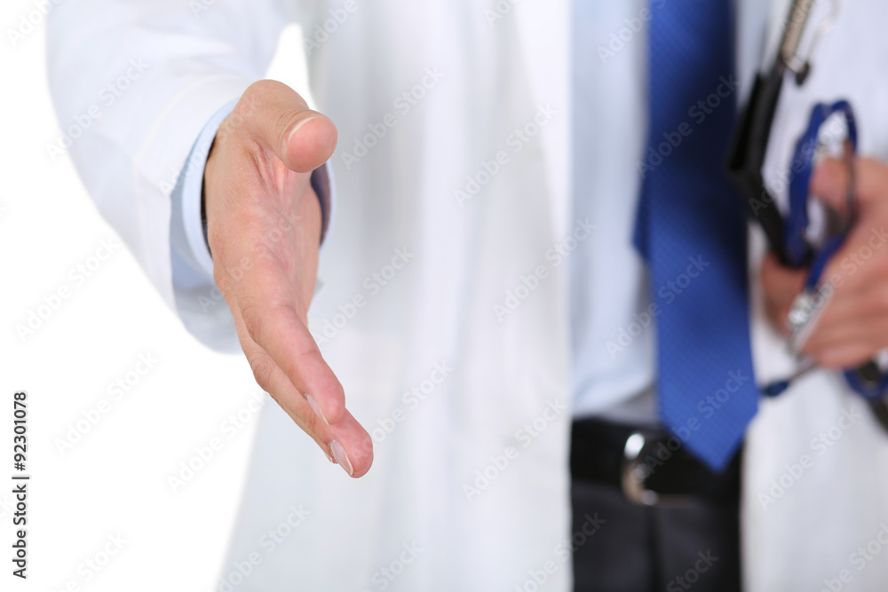 Male medicine doctor offering hand to shake Male medicine doctor offering hand to shake