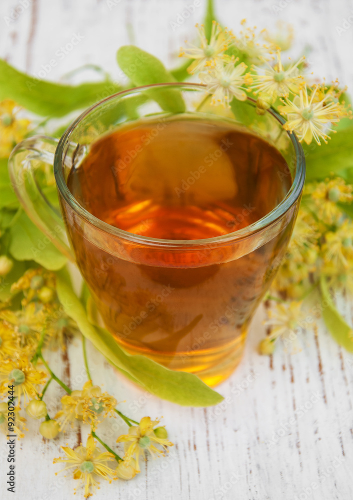 Cup of herbal tea with linden flowers Cup of herbal tea with linden flowers