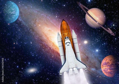 Fototapeta Naklejka Na Ścianę i Meble -  Outer space travel shuttle rocket launch spaceship spacecraft planet. Elements of this image furnished by NASA.