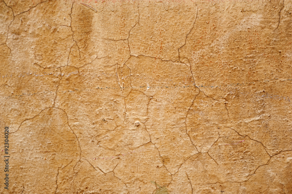 Texture of old wall covered with yellow stucco Texture of old wall covered with yellow stucco