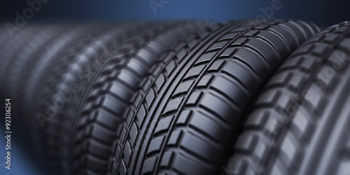 Foto Row of rubber tire 3D, on blue background