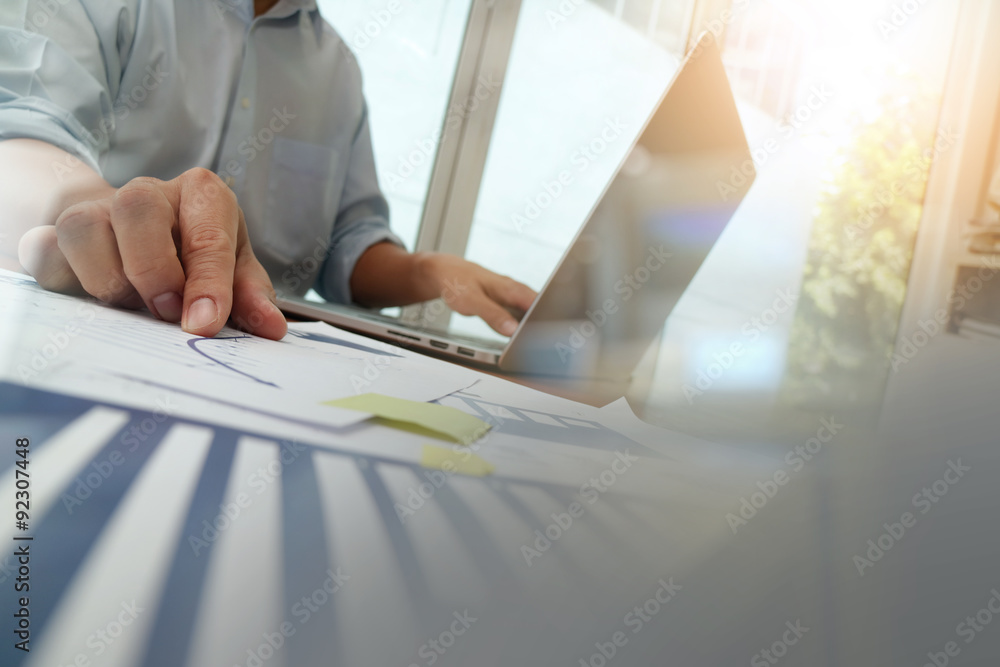 Naklejka premium Double exposure of businessman hand working with new modern comp