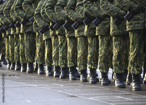 Soldiers in camouflage military uniform on rest position photo