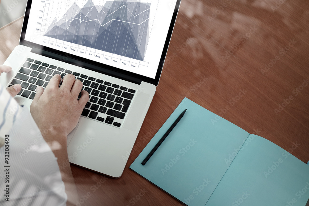 top view of Double exposure of businessman hand working with new top view of Double exposure of businessman hand working with new
