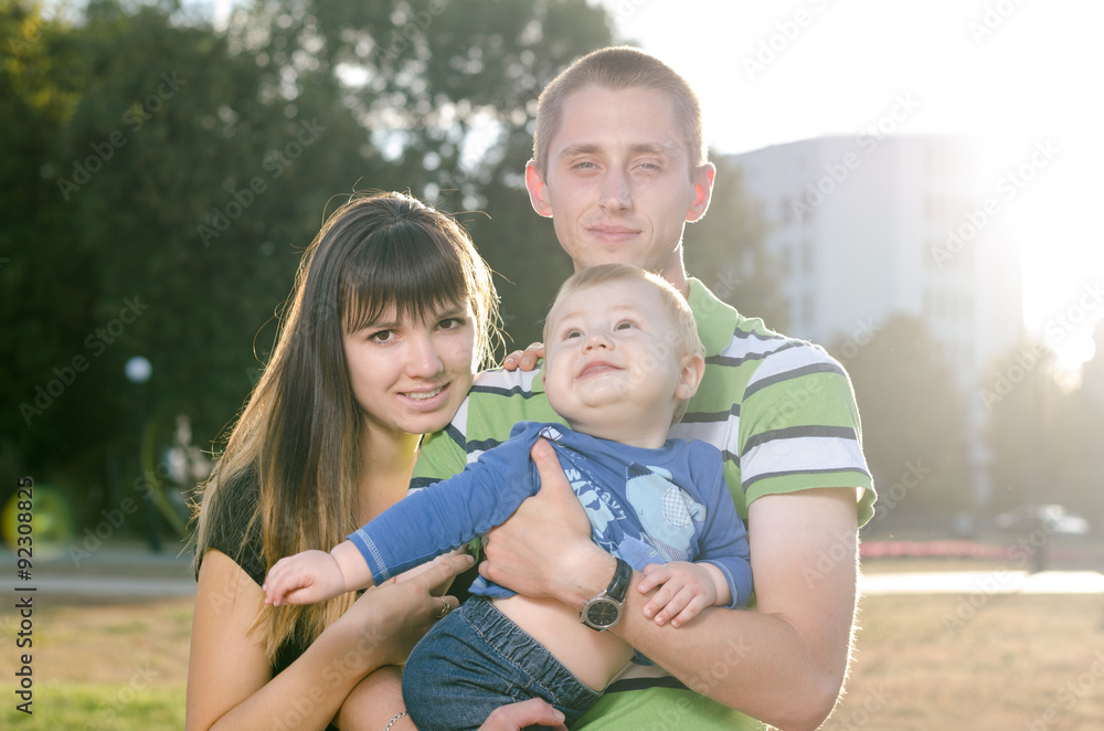 Fototapeta premium young family with a baby