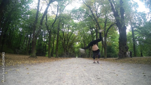 Youg dancer dancing breakdance in the parks photo