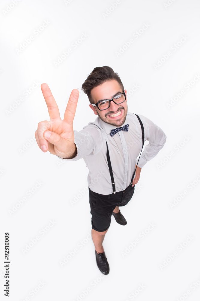 Handsome man showing okay sign in studio Handsome man showing okay sign in studio