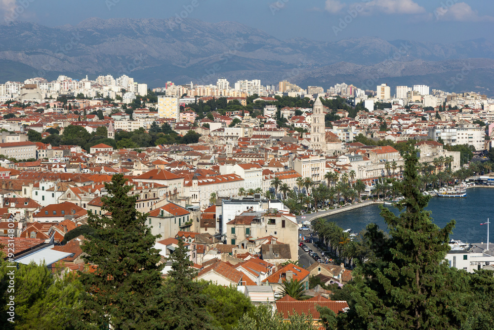 View of Split's waterfront, historic old town and beyond from above in Croatia.
