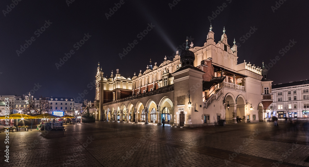 The Main Market Square in Krakow, Poland, with famous Sukiennice (Cloth hall)  in the night