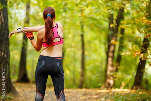Принти на полотні woman runner stretching before her workout