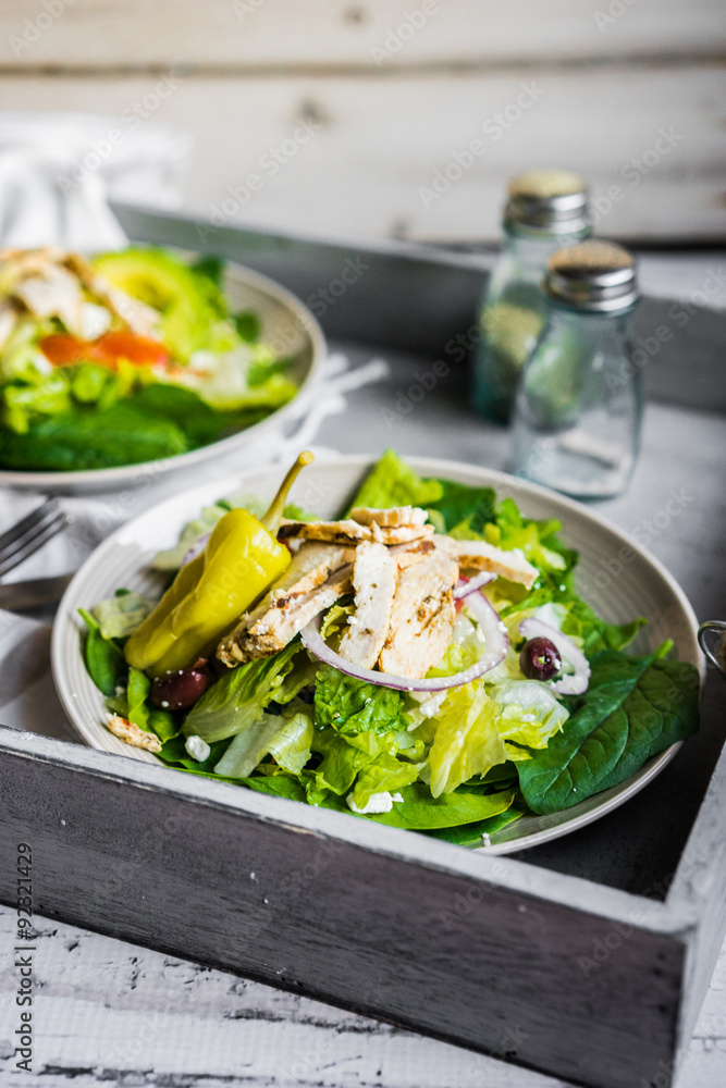 Green chicken salad on wooden background Green chicken salad on wooden background