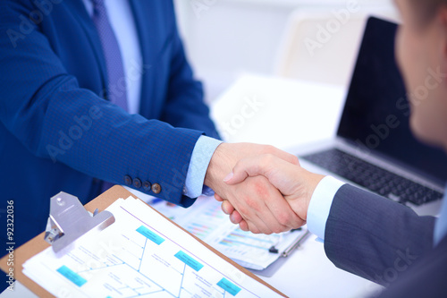 Business people shaking hands, finishing up a meeting