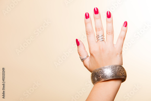 фотографія Female hand with manicure and armlet
