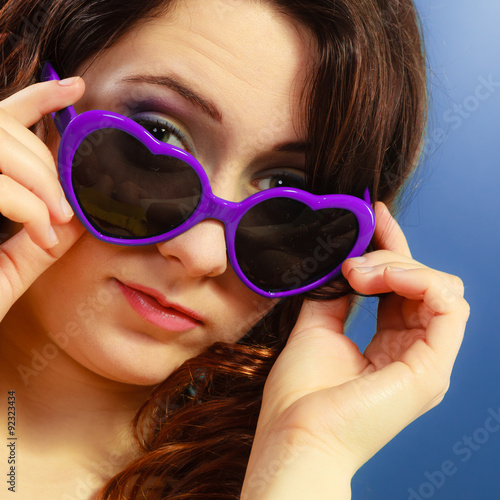 Girl in violet sunglasses portrait