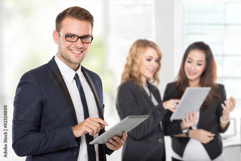 A businessman with his colleague using tablet pc A businessman with his colleague using tablet pc