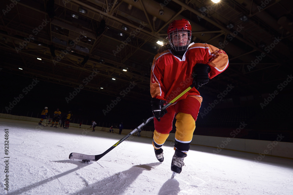Obraz premium teen ice hockey player in action