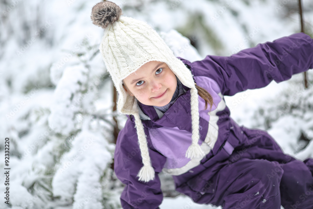 Young girl fooling around in the snow in frosty day Young girl fooling around in the snow in frosty day