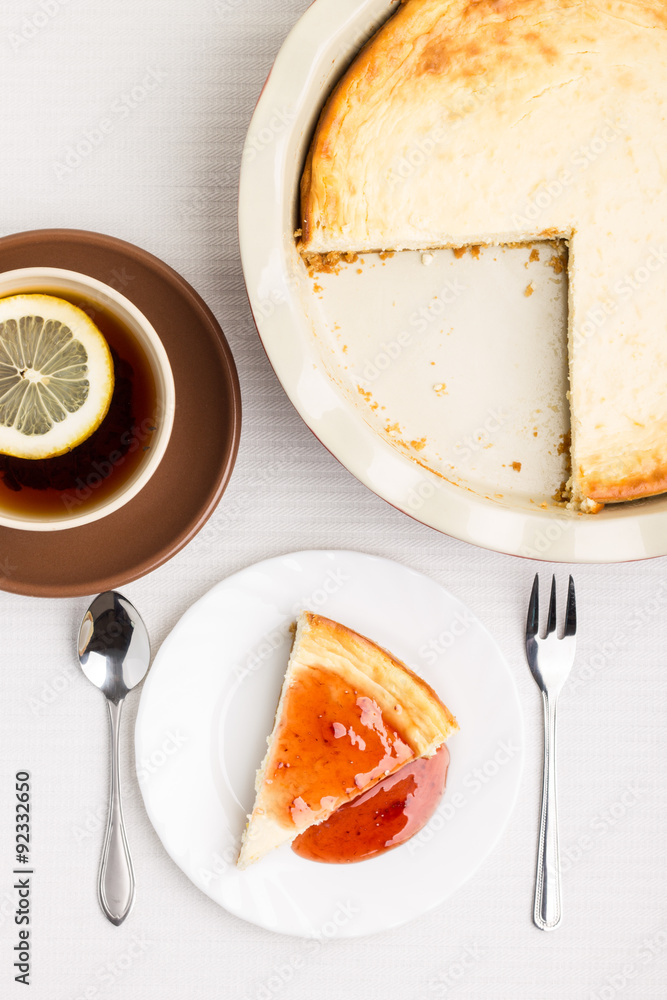 Wedge of homemade cheesecake with tea Wedge of homemade cheesecake with tea